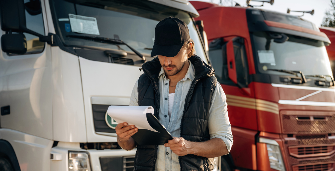 a man checking papers for the trucks ELD Compliance