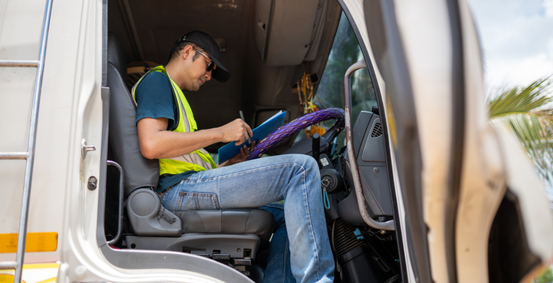 a driver checking details of the truck