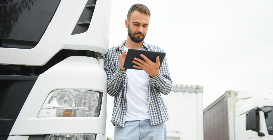 a man checking management software for trucks