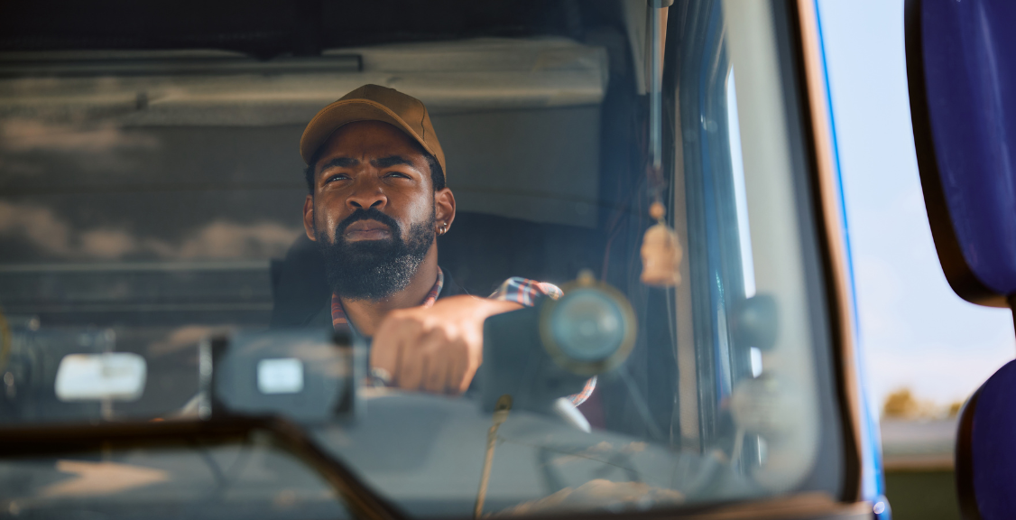 a driver focusing on he road while driving the truck