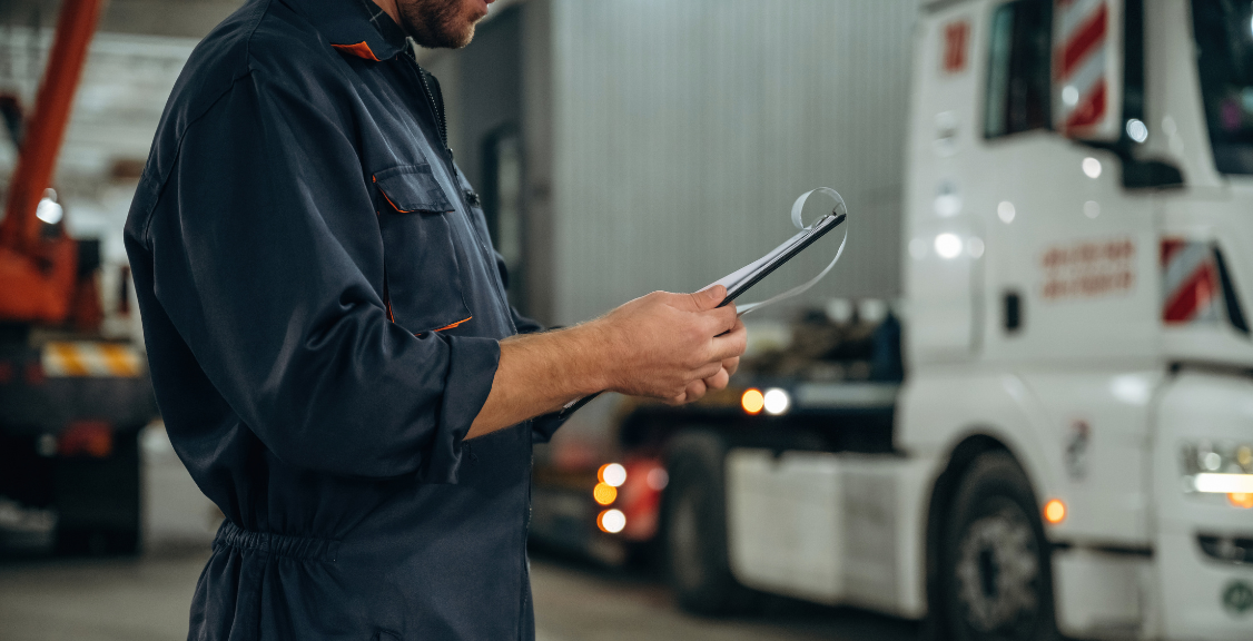 an inspector checking the condition of the truck