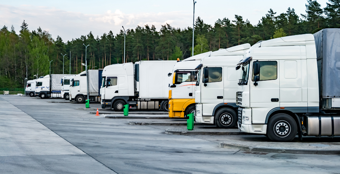 trucks in line with containers for checking for ELD compliance